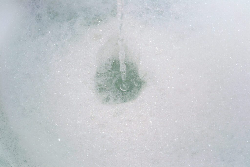 water running into bubble bath